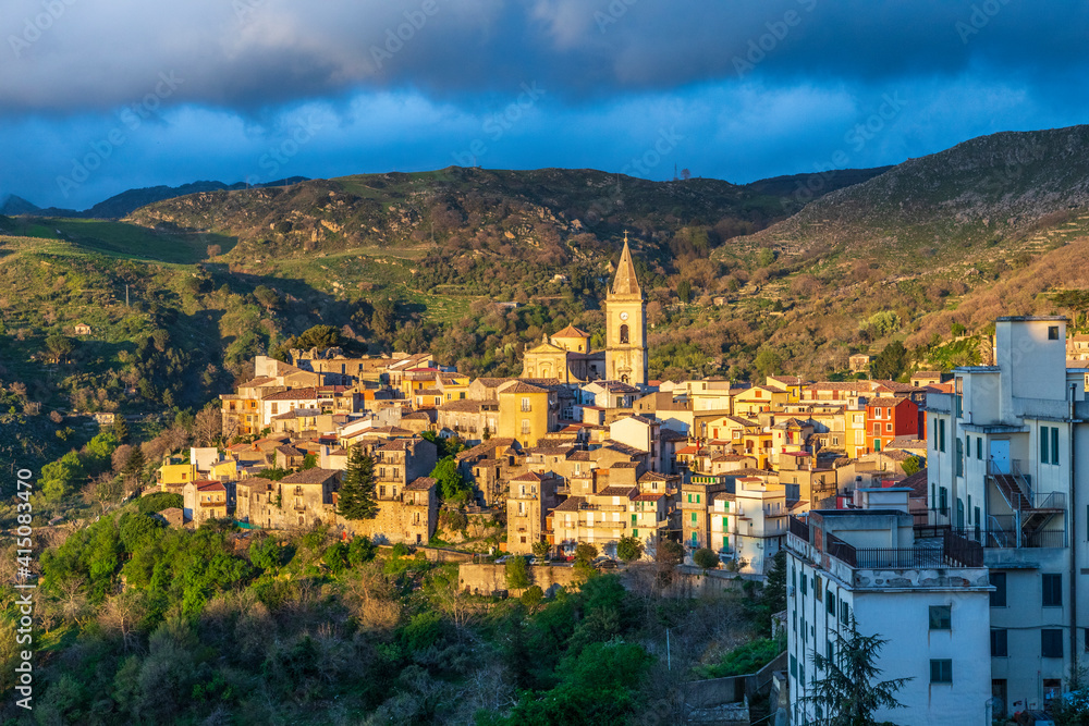 Obraz premium Italy, Sicily, Messina Province, Novara di Sicilia. The medieval hill town of Novara di Sicilia at sunset.