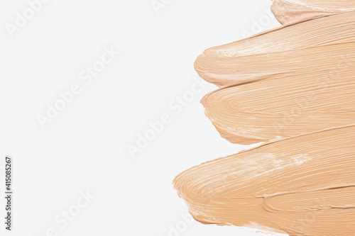Samples of makeup foundation on white background