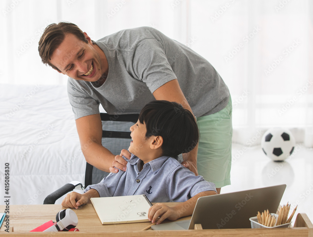 Father playing with mixed-race son with happy and joyful in home Father playing with mixed-race son with happy and joyful in home