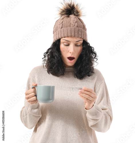 Sick young woman with therm...