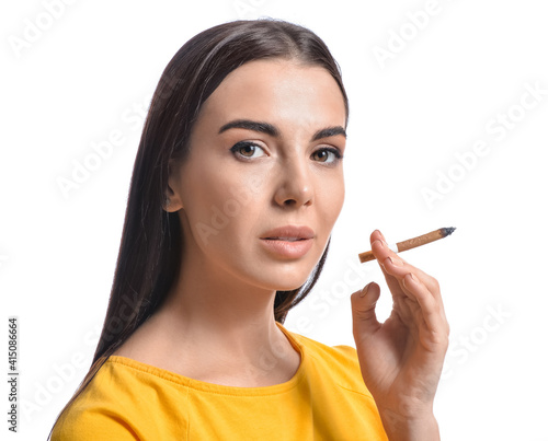 Young woman with cigarette ...