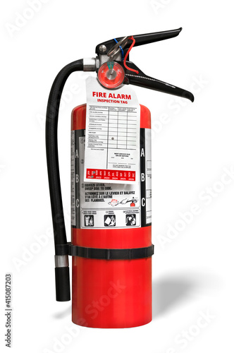 Foto Fire extinguisher with inspection tag