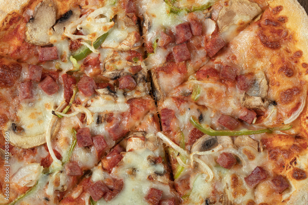 Cooked pizza dough with mixed chopped and minced ingredients Cooked pizza dough with mixed chopped and minced ingredients