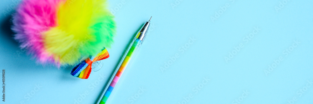 Obraz premium Colorful stationery. multicolored pen on blue background. banner
