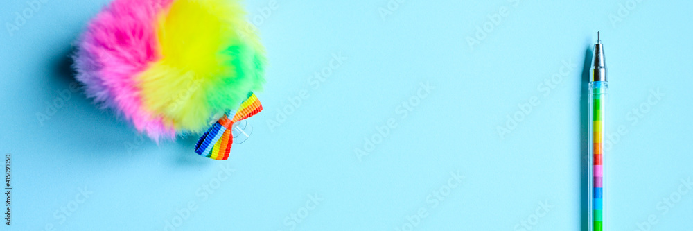 Colorful stationery. multicolored pen on blue background. banner