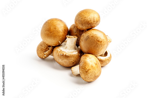 Pile of champignons with brown hat isolated on white