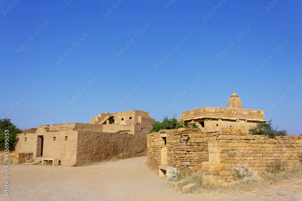 Old house and temple view of Kuldhara an abandoned village, Jaisalmer Rajasthan, India. Established in 13th century inhabited by Paliwal Brahmins.