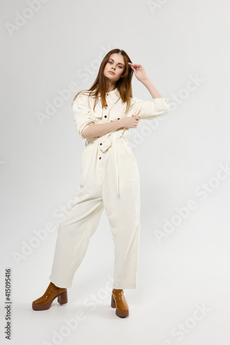 woman in trendy clothes modern style white suit full length studio