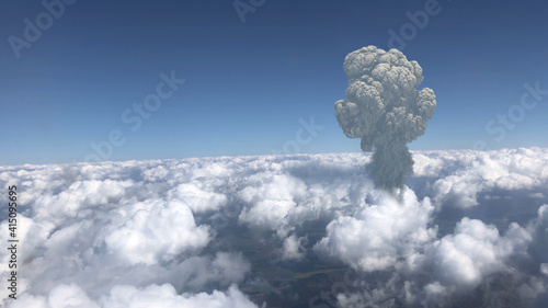 Large mushroom cloud explosion or volcano over Clouds , Atom nuclear explosion or volcanic eruption from plane point of view 
