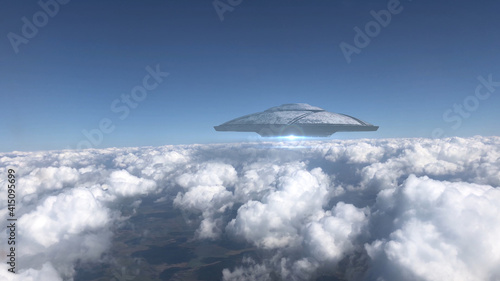 3D rendering- Ufo Flying Saucer hovering over Clouds, Metalic shape from plane point of view, Alien invasion concept photo