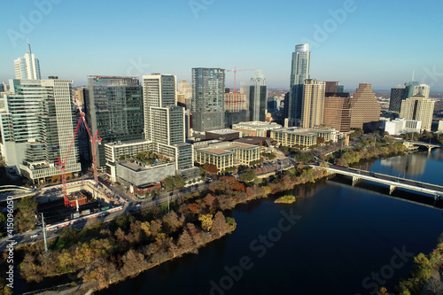 Aerial view of downtown Austin along the Colorado River at sunset 