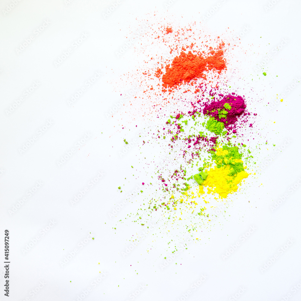 Splash of dry powder colors on white background. Assorted color samples.