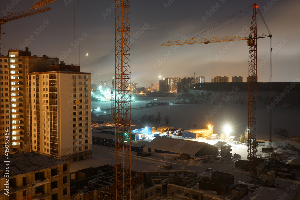 Night view of the construction site of a new house. Moscow region, Dzerzhinsky. January 2021. Night view of the construction site of a new house. Moscow region, Dzerzhinsky. January 2021.