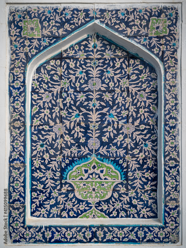 Beautiful traditional floral motif on blue and white ceramic tiles on wall of Makhdum Nuh tomb in Hala, Sindh, Pakistan
