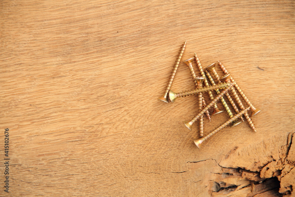 screw on a workbench as a background screw on a workbench as a background