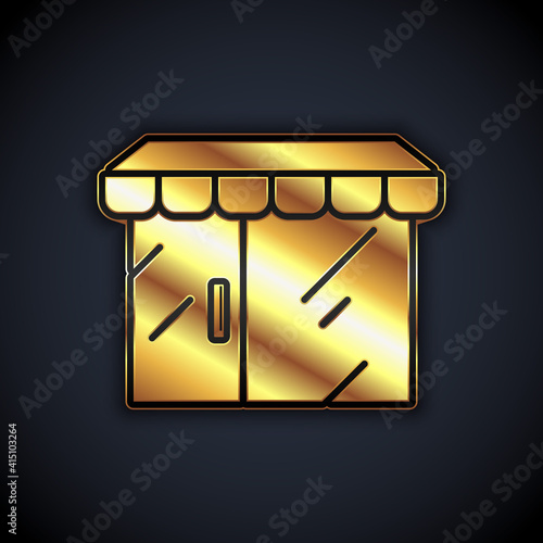 Gold Shopping building or market store icon isolated on black background. Shop construction. Vector.