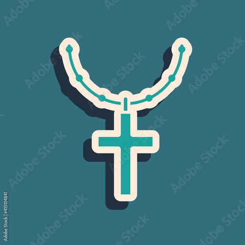 Green Christian cross on chain icon isolated on green background. Church cross. Long shadow style. Vector.