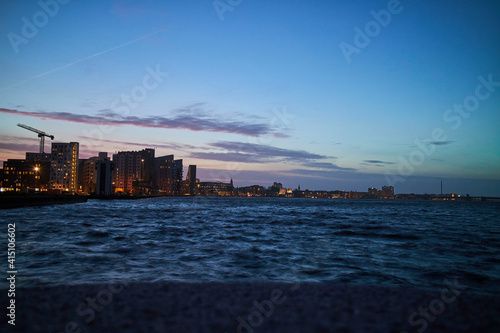 landscape of city by the water at night © Johny