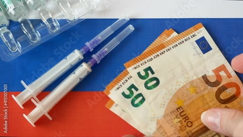 russian flag, vaccine sputnik-V or EpiVacCorona and money, money for purchase and production vaccine concept