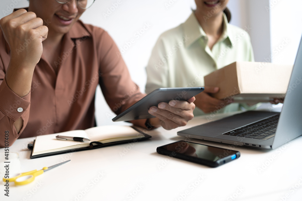 Small business owner packing in the cardbox preparing parcel for delivery online selling sell Online on the Internet from home. Small business owner packing in the cardbox preparing parcel for delivery online selling sell Online on the Internet from home.