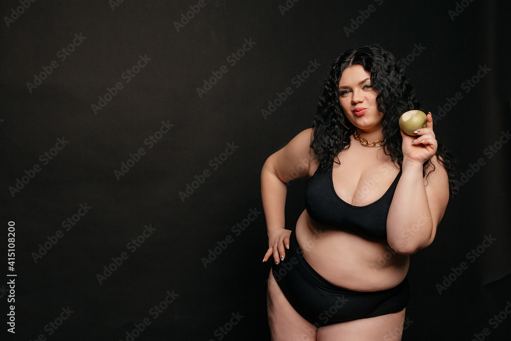 Plus size model in lingerie, fat sexy woman in underwear on black
