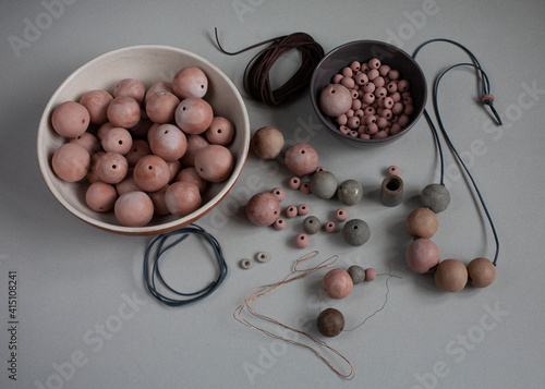 Handmade clay beads and necklace. Ceramic handcrafted items and stoneware plates.
