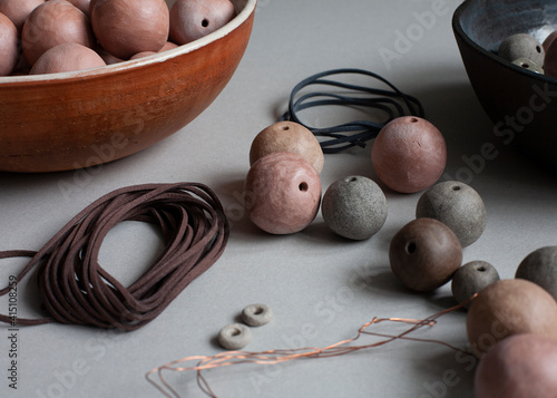 Handmade clay beads and necklace. Ceramic handcrafted items and stoneware plates.
