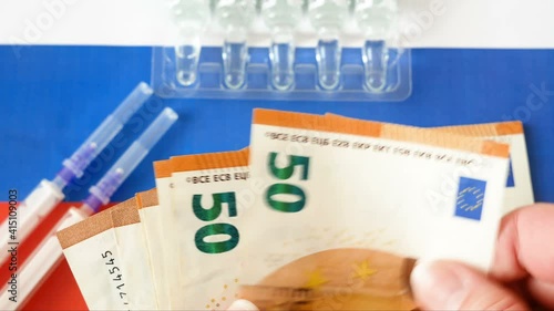 russian flag, vaccine sputnik-V or EpiVacCorona and money, money for purchase and production vaccine concept