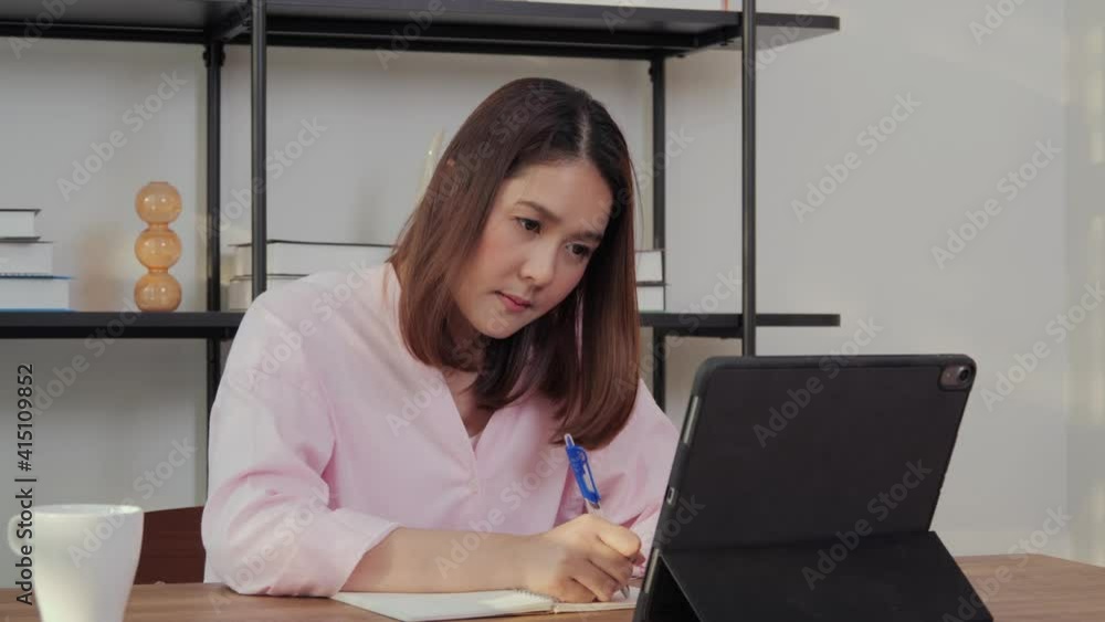 Beautiful woman using tablet to work online at office. Beautiful woman using tablet to work online at office.