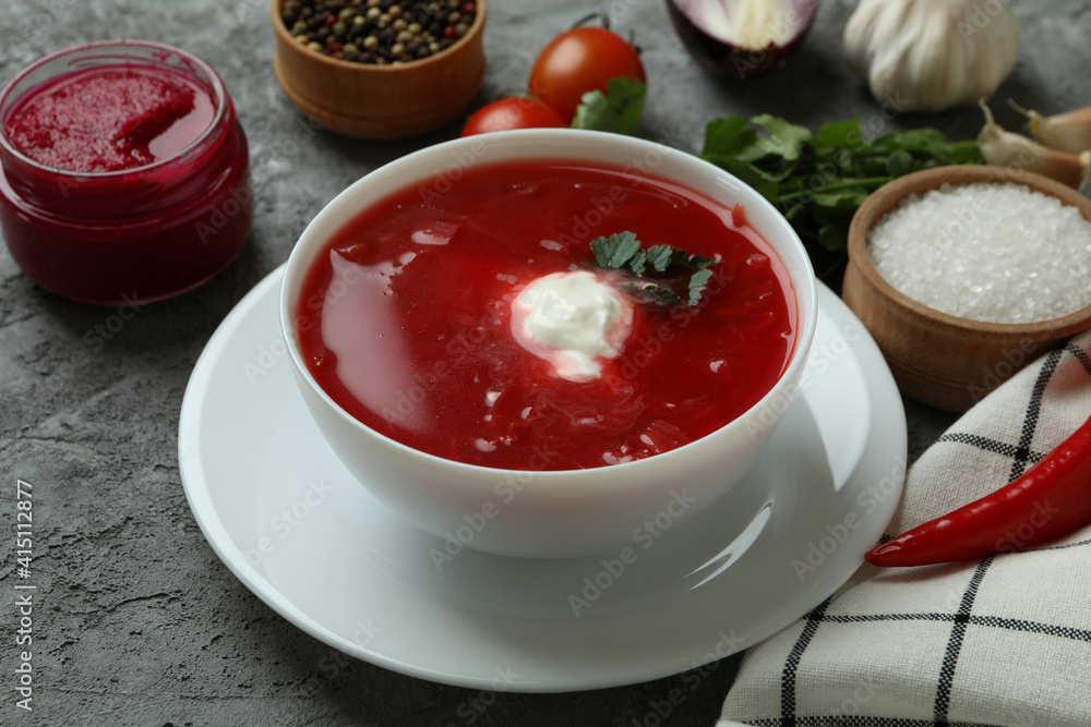 Concept of tasty eating with borscht on gray background Concept of tasty eating with borscht on gray background