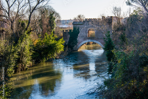 Canvas Print Medieval bridge in Rome,The Ponte Nomentano (Ponte Tazio) over the river Aniene