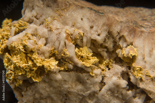 Closeup shot of native gold isolated on a black background photo