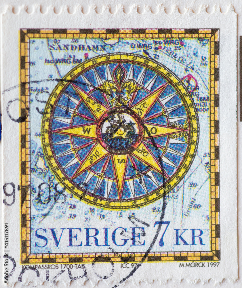 SWEDEN - CIRCA 1997: a postage stamp printed in Sweden with an artistic compass rose. Map symbols in the background..Iceland