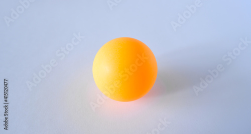 Obraz na płótnie orange ping pong ball on white background close