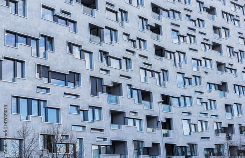 Modern building facade with irregular form of windows.  photo