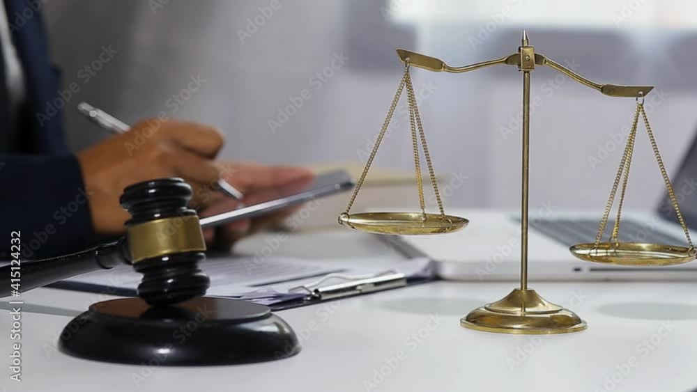 justice gavel and law working at table office. justice gavel and law working at table office.