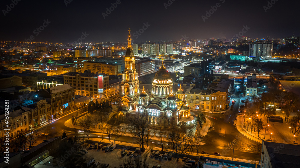Aerial winter night view to Holy Annunciation Cathedral - Blagovischenskiy sobor, with panorama of city in Kharkiv, Ukraine