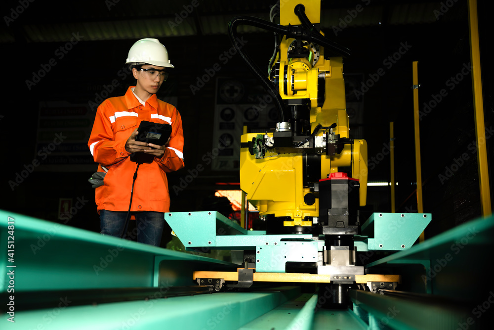 Fototapeta premium woman working engineering or technical inspection the system of machinery by online mobile device connecting to ensure working in order by checklist part and quality control