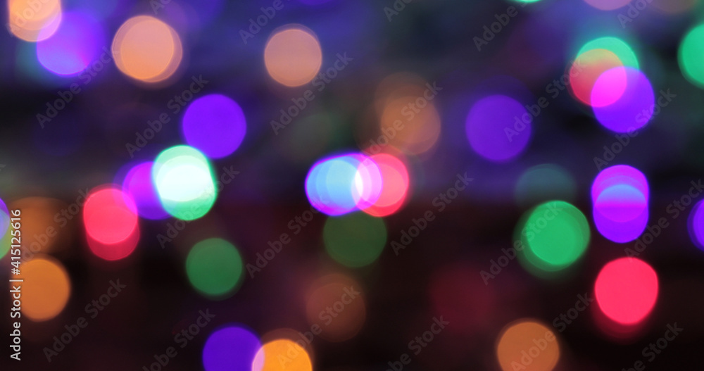 Colored bokeh abstract background. Decoration at Christmas holiday.