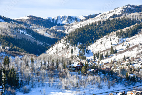 Vacation homes on the hillside in Park City ski area during winter in the Wasatch Mountains near Salt Lake City, Utah photo