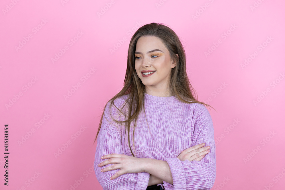 Young pretty woman with long hair standing over isolated pink background with a happy face standing and smiling with a confident smile showing teeth with arms crossed Young pretty woman with long hair standing over isolated pink background with a happy face standing and smiling with a confident smile showing teeth with arms crossed