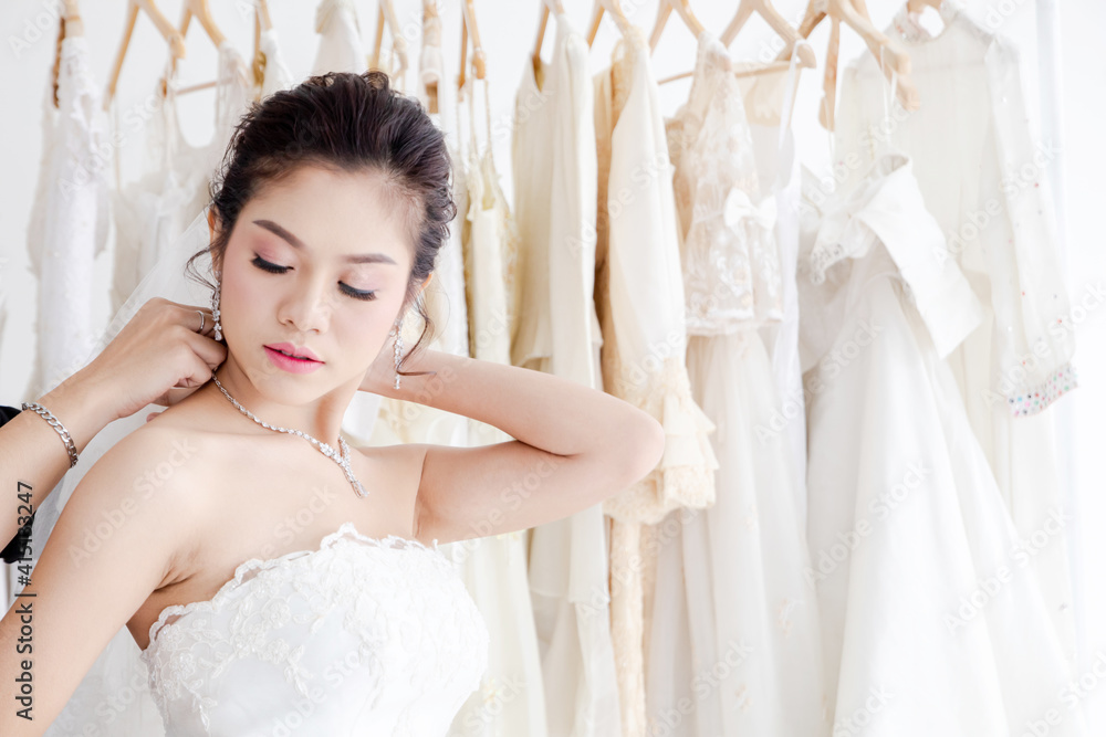 Beautiful Asian bride happy with bridesmaids together help each other ...