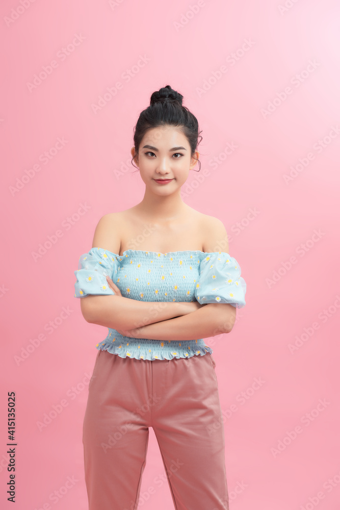 Portrait of charming girl folded arms isolated over pink pastel color background Portrait of charming girl folded arms isolated over pink pastel color background