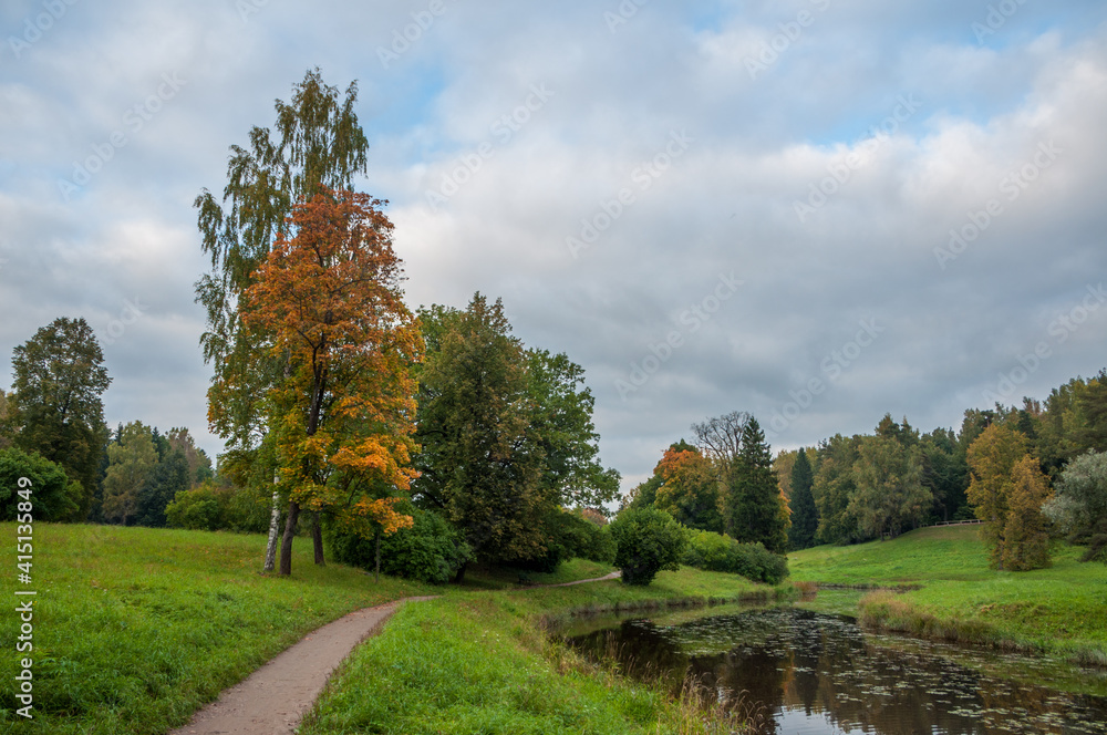 Pavslovsky park early autumn, pathway and river