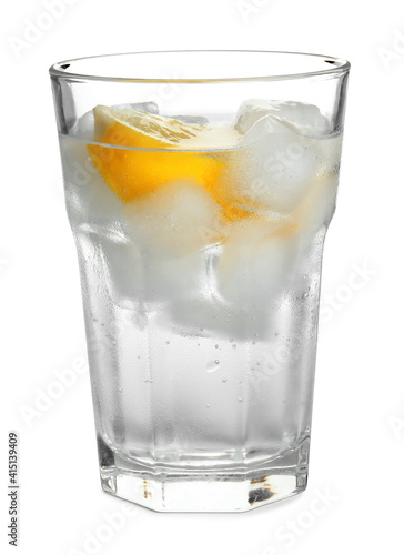 Soda water with lemon slices and ice cubes isolated on white