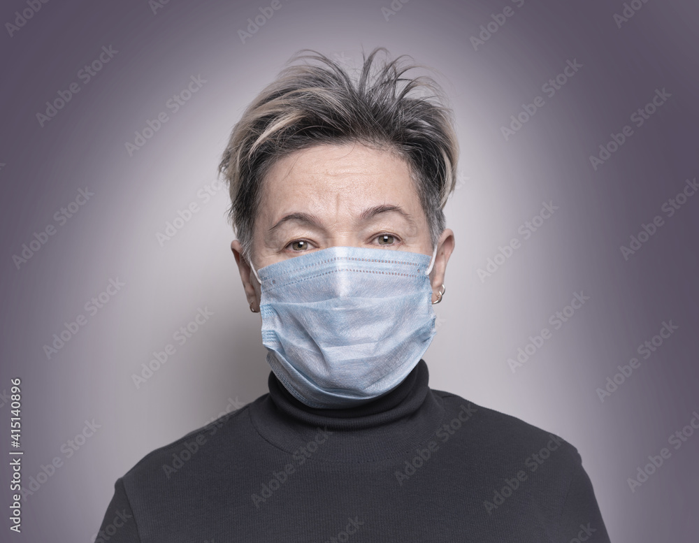 Senior woman in medical mask look forward . Concept of preventions of infection, diseases, viruses. Global quarantine due of CoViD-19. Senior woman in medical mask look forward . Concept of preventions of infection, diseases, viruses. Global quarantine due of CoViD-19.