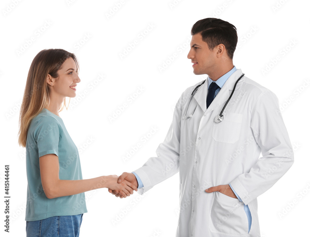 Doctor and patient shaking hands on white background Doctor and patient shaking hands on white background