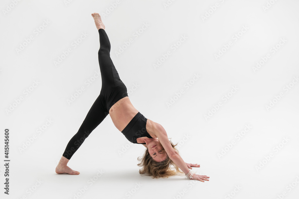 Sporty blonde woman exercising yoga on white background Sporty blonde woman exercising yoga on white background
