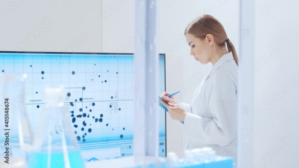 Professional team of scientists is working on a vaccine in a modern scientific research laboratory. Genetic engineer workplace. Future technology and science. Professional team of scientists is working on a vaccine in a modern scientific research laboratory. Genetic engineer workplace. Future technology and science.