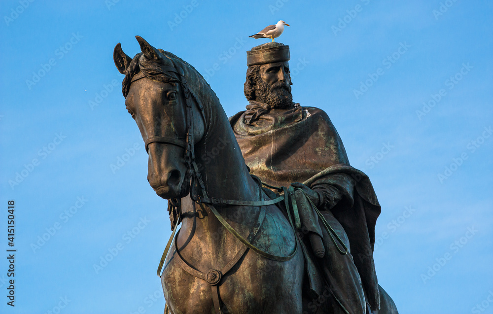Seagull sits on the head of the statue Giuseppe Garibaldi Italian Hero and Patriot in Rome